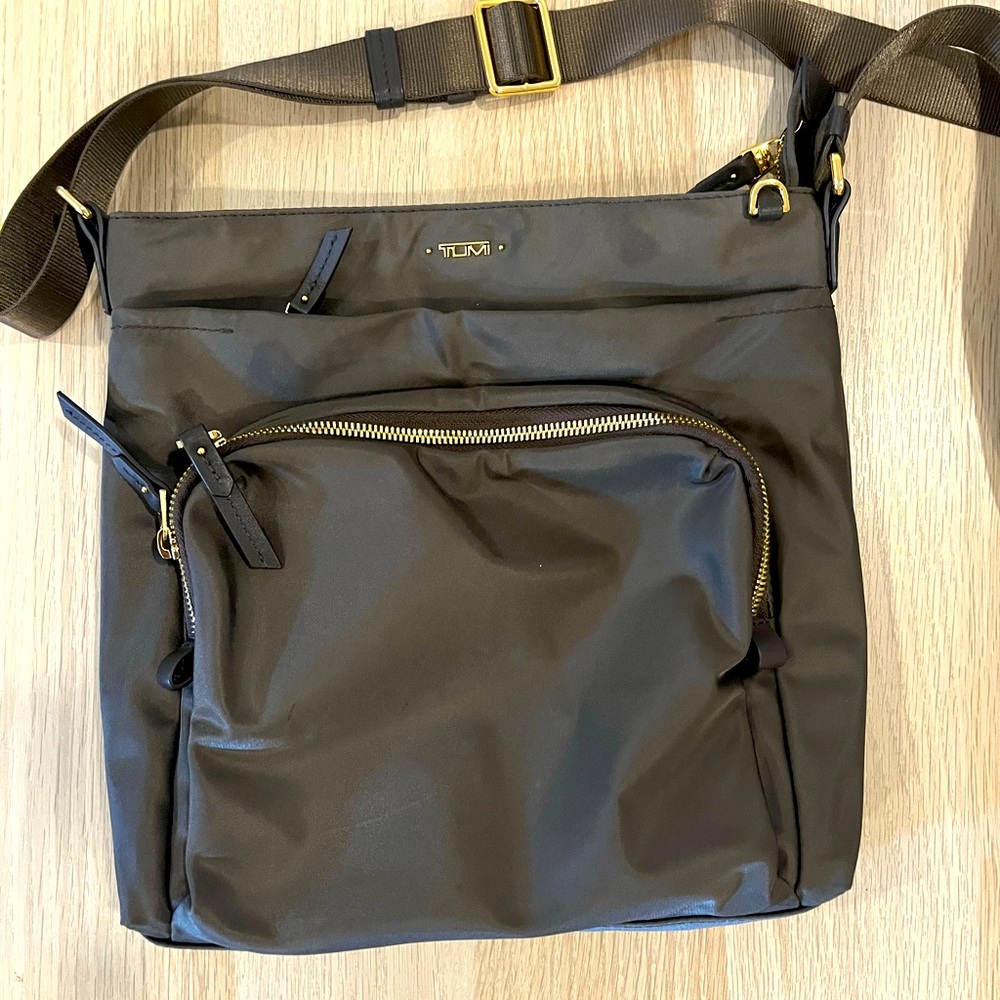 Tumi voyager crossbody - gold zippers. New condition